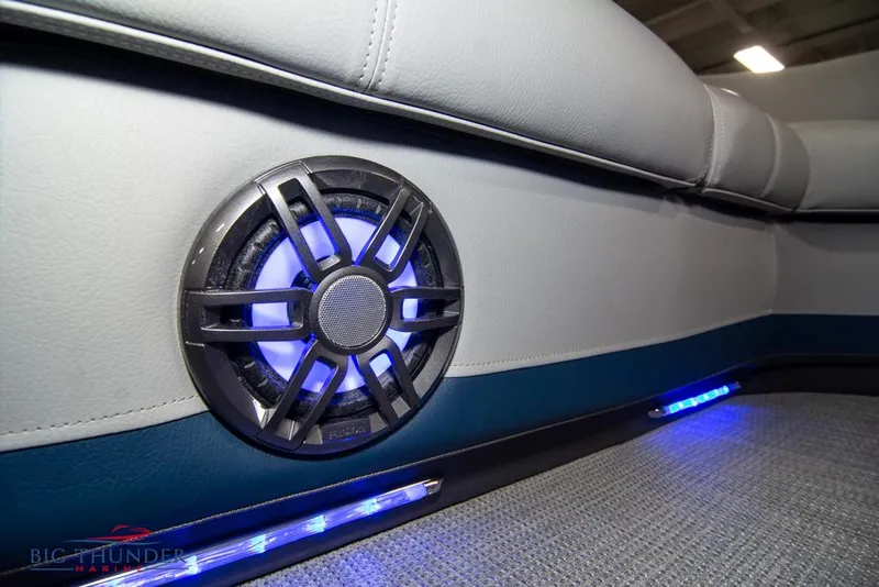Slide: The Image of 2022 Manitou 25 Oasis SR SHP interior with illuminated speaker and LED lighting. - 15