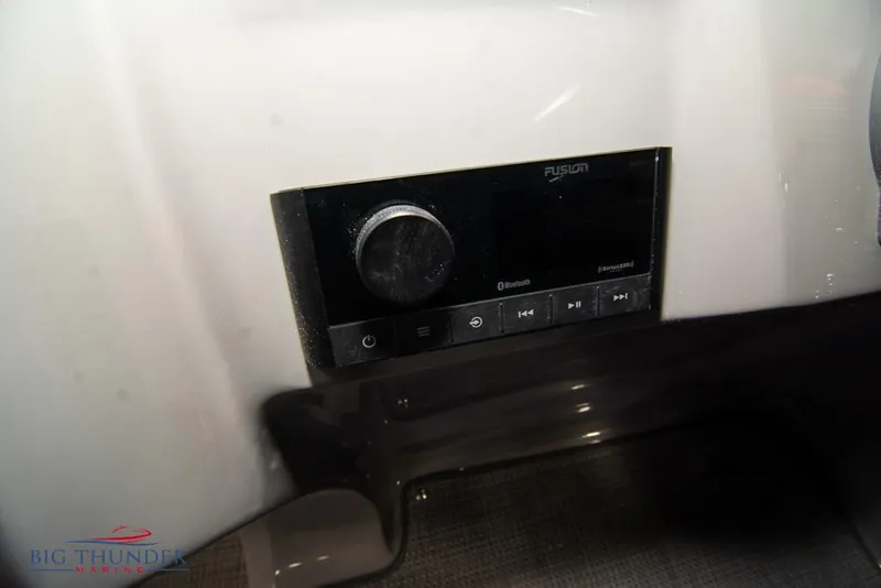 Slide: The Image of 2022 Manitou 25 Oasis SR SHP boat stereo system, Fusion Bluetooth audio controls. - 25