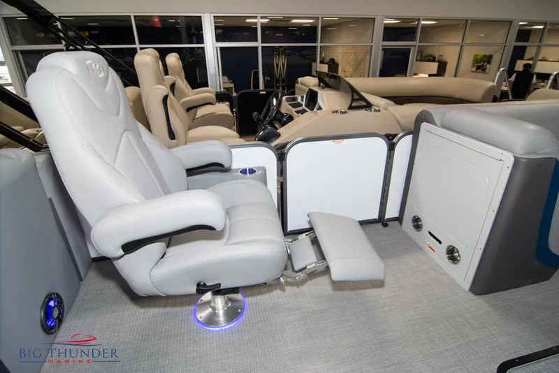 Slide: The Image of 2022 Manitou 25 Oasis SR SHP luxury boat interior with captain's chair. - 32