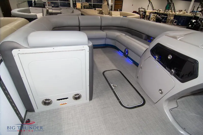 Slide: The Image of Interior of a 2022 Manitou 25 Oasis SR SHP pontoon boat with gray seating. - 33