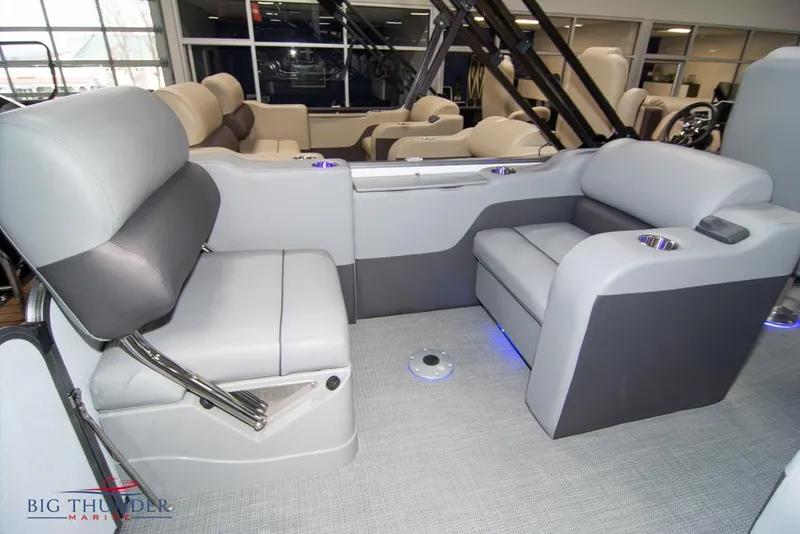 Slide: The Image of 2022 Manitou 25 Oasis SR SHP interior seating area with gray upholstery. - 37