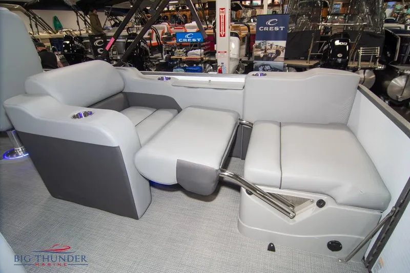 Slide: The Image of 2022 Manitou 25 Oasis SR SHP boat interior with gray seating. - 39