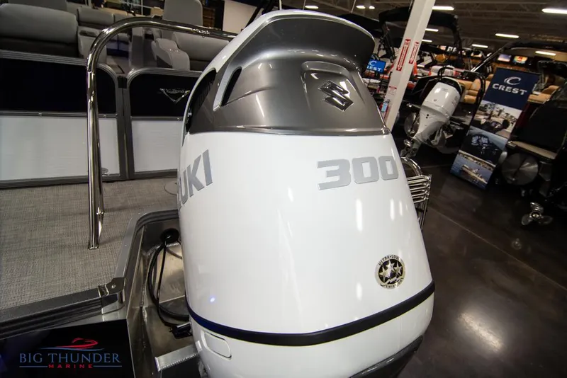 Slide: The Image of 2022 Manitou 25 Oasis SR SHP with Suzuki 300 outboard motor at Big Thunder Marine showroom. - 4