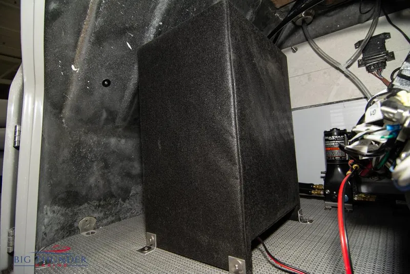 Slide: The Image of 2022 Manitou 25 Oasis SR SHP engine compartment with electrical components and wiring. - 47