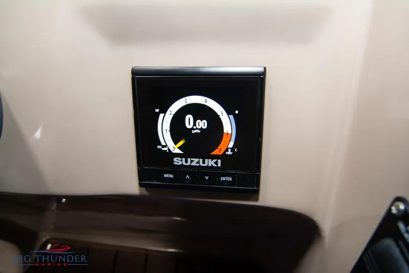 Slide: The Image of Suzuki gauge on 2022 Manitou 25 Oasis SR SHP boat dashboard. - 23