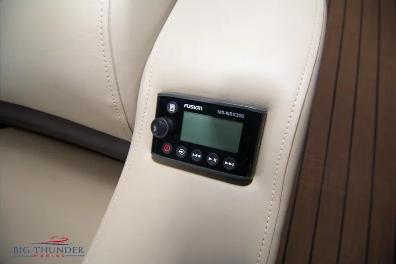 Slide: The Image of Close-up of 2022 Manitou 25 Oasis SR SHP boat's Fusion MS-NRX300 audio control. - 37