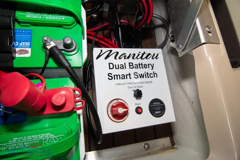 Slide: The Image of 2022 Manitou 25 Oasis SR SHP dual battery smart switch and wiring. - 44