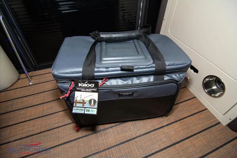 Slide: The Image of Igloo cooler on the deck of a 2022 Manitou 25 Oasis SR SHP boat. - 48