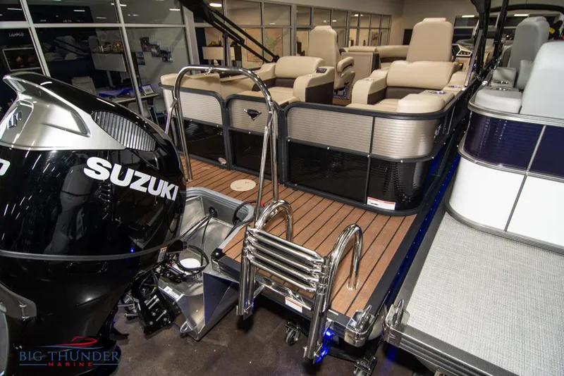 Slide: The Image of 2022 Manitou 25 Oasis SR SHP pontoon boat with Suzuki outboard motor. - 7