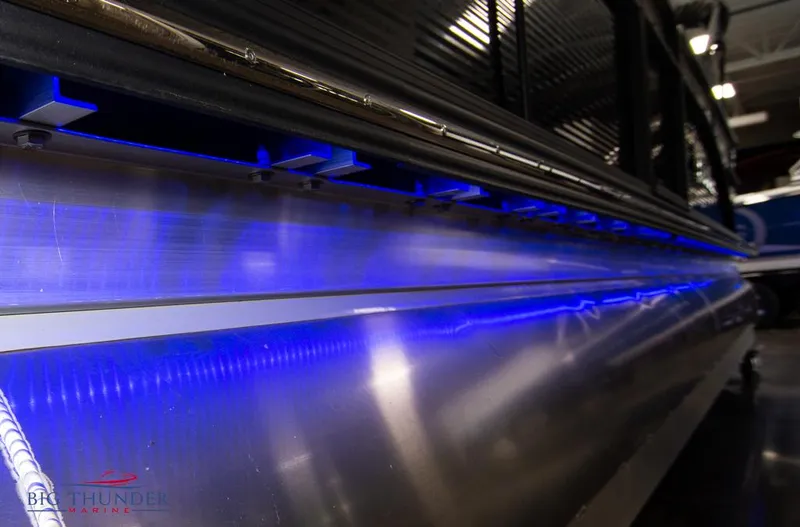 Slide: The Image of 2022 Manitou 25 Oasis SR SHP pontoon boat with blue LED lighting. - 9