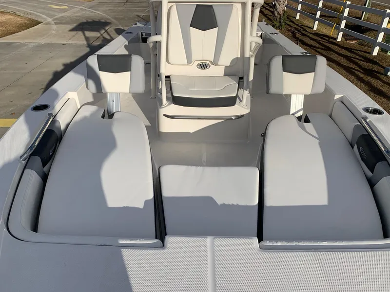 Slide: The Image of 2024 Robalo 206 Cayman boat interior with cushioned seating and modern design. - 5