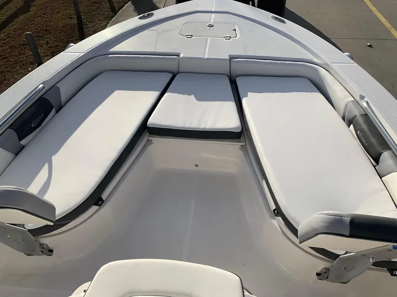 Slide: The Image of 2024 Robalo 206 Cayman boat with spacious cushioned seating area. - 12