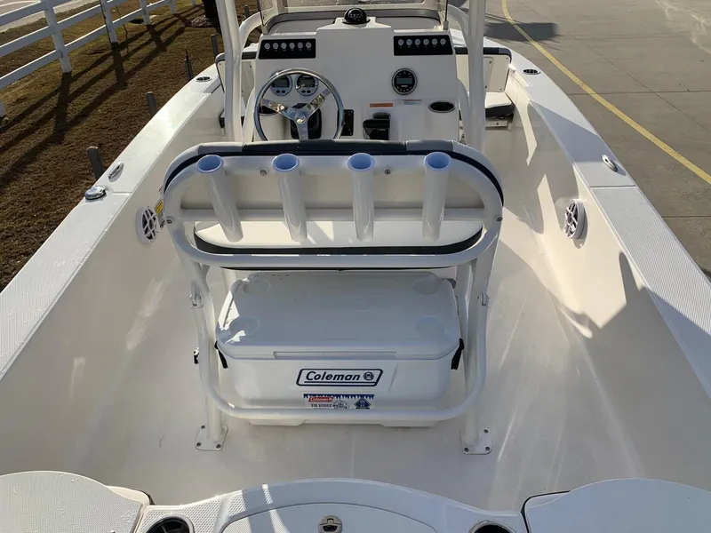 Slide: The Image of 2024 Robalo 206 Cayman boat interior with Coleman cooler and rod holders. - 6