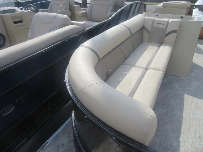 Slide: The Image of 2023 Crest Classic LX 240 SLC CPT pontoon boat with beige seating. - 5