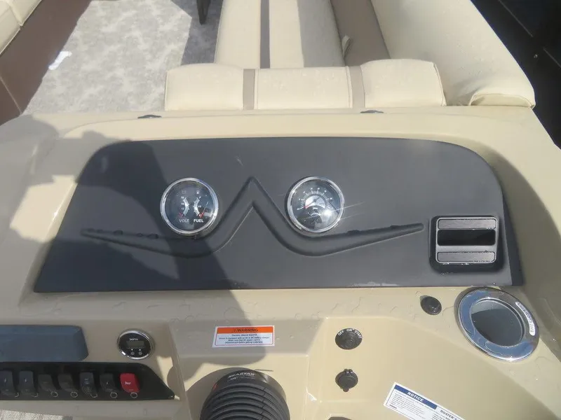 Slide: The Image of Dashboard of 2023 Crest Classic LX 240 SLC CPT boat with gauges and controls. - 7