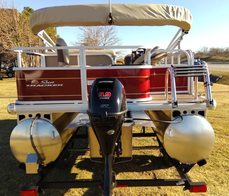 Slide: The Image of 2023 Sun Tracker Bass Buggy 18 DLX pontoon boat with Mercury 9.9 motor. - 2