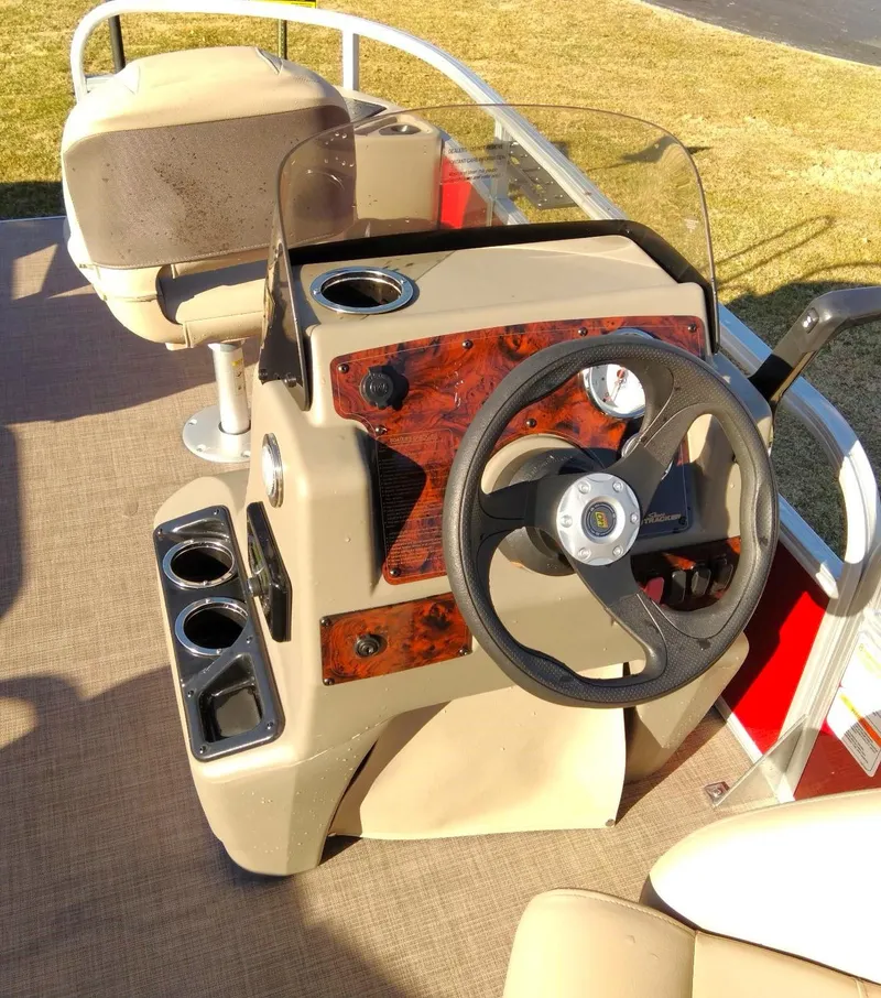 Slide: The Image of 2023 Sun Tracker Bass Buggy 18 DLX boat console and steering wheel. - 6