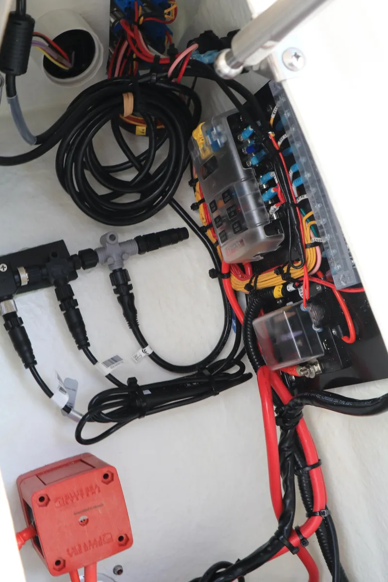 Slide: The Image of Electrical wiring and components inside a 2023 Highfield 390 Sport boat. - 12