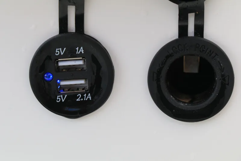 Slide: The Image of Dual USB charging ports on 2023 Highfield 390 Sport boat, 5V 1A and 2.1A outputs. - 19