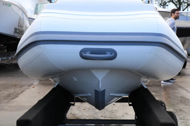 Slide: The Image of 2023 Highfield 390 Sport boat on trailer, front view, showcasing sleek design. - 4