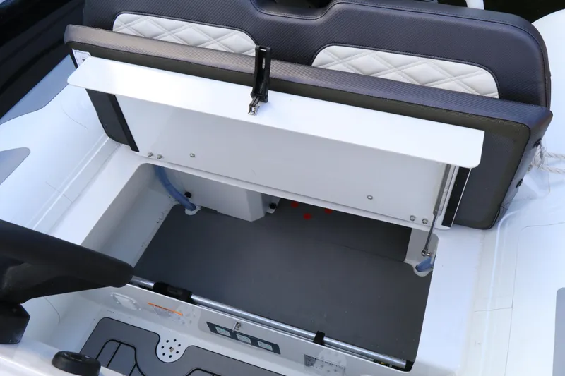Slide: The Image of 2023 Highfield 390 Sport boat interior storage compartment with cushioned seating. - 6