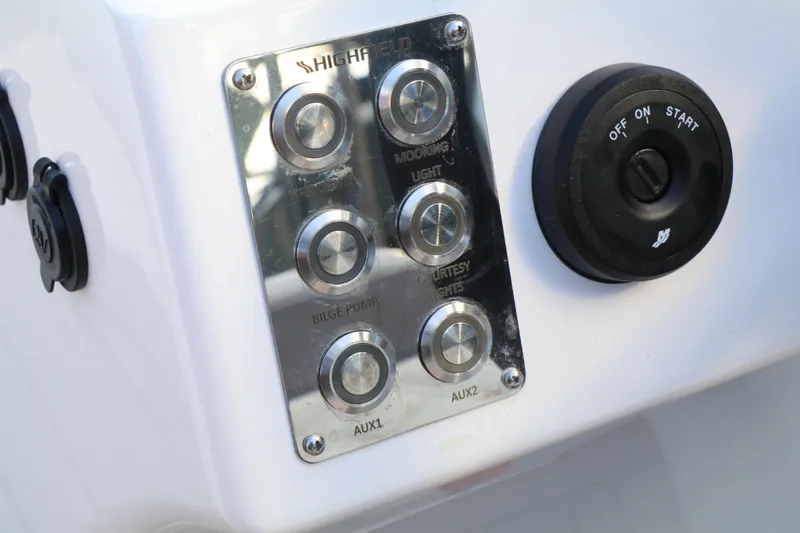 Slide: The Image of Control panel of 2023 Highfield 390 Sport boat with switches and ignition. - 9