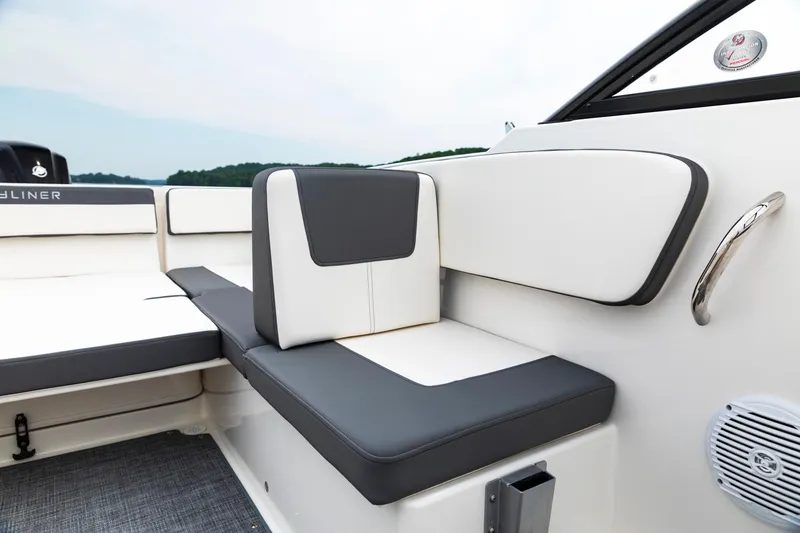 Slide: The Image of 2023 Bayliner VR4 OB boat interior with cushioned seating and modern design. - 15