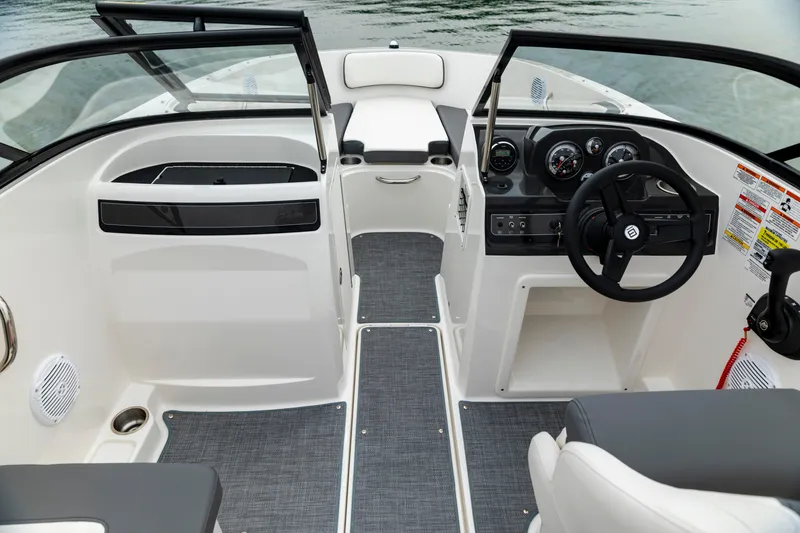 Slide: The Image of 2023 Bayliner VR4 OB boat interior with modern dashboard and seating. - 8