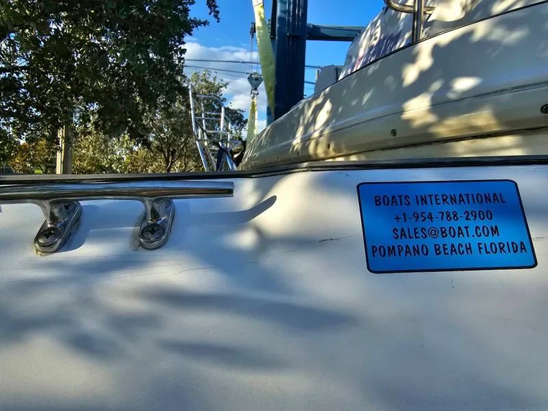 Slide: The Image of Century 2301 Center Console boat, 2023 model, with contact details for Boats International. - 34