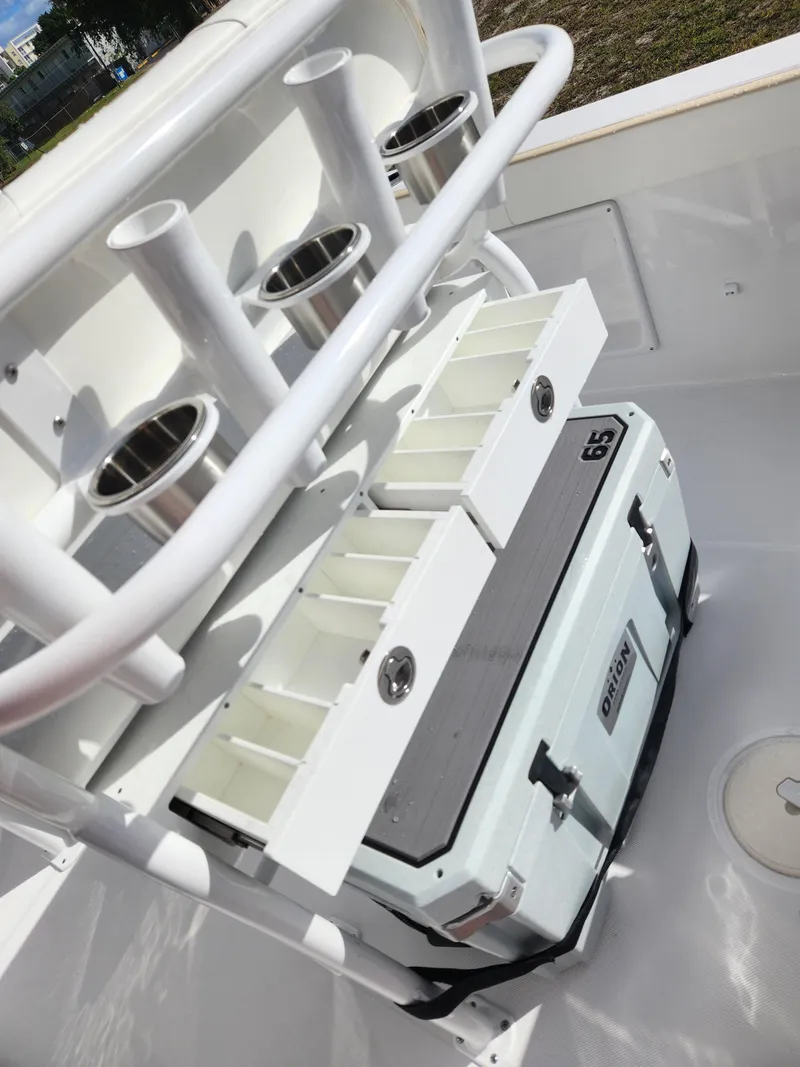 Slide: The Image of 2023 Century 2301 Center Console boat with rod holders and storage compartments. - 40