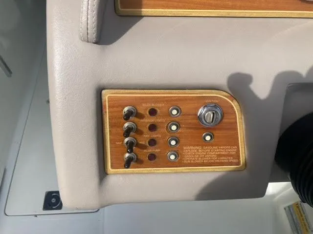 Slide: The Image of Cobalt 246 boat dashboard with switches and ignition, 2000 model. - 10