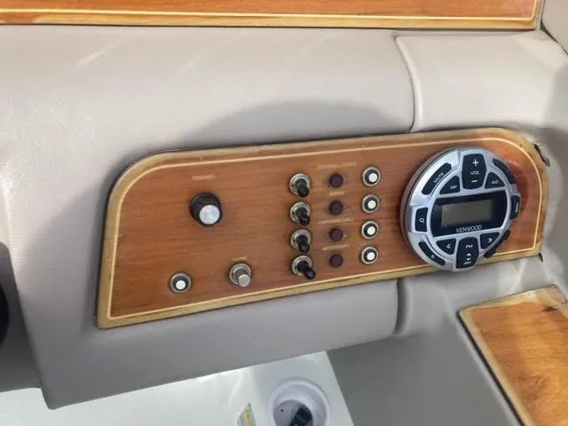 Slide: The Image of Dashboard of a 2000 Cobalt 246 boat with control panel and Kenwood stereo. - 11