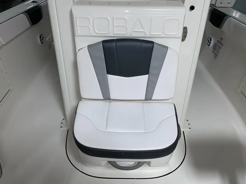 Slide: The Image of 2026 Robalo R270 boat seat with stylish white and gray upholstery. - 13