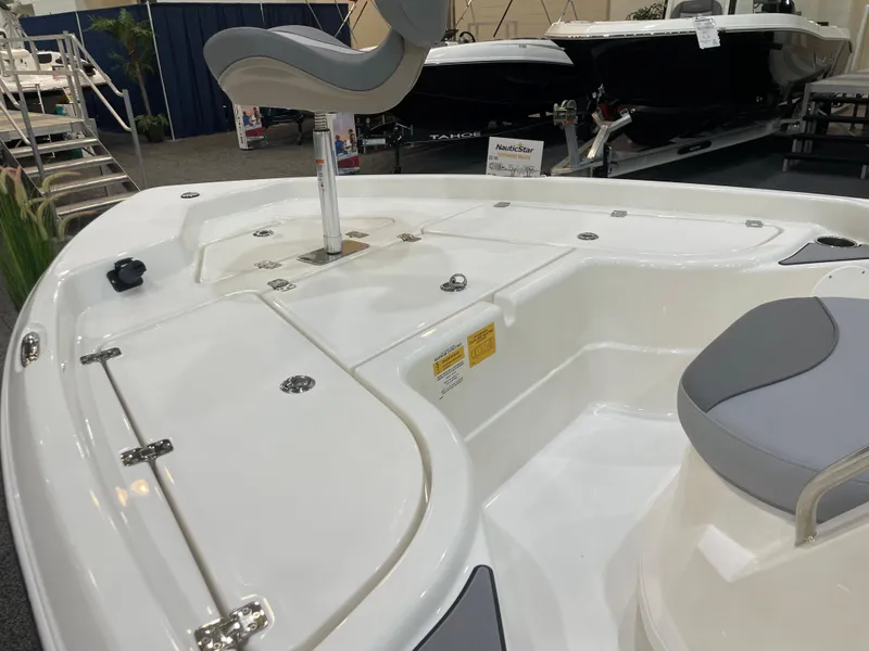 Slide: The Image of 2023 NauticStar 195 Bay boat interior with seating and storage compartments. - 6