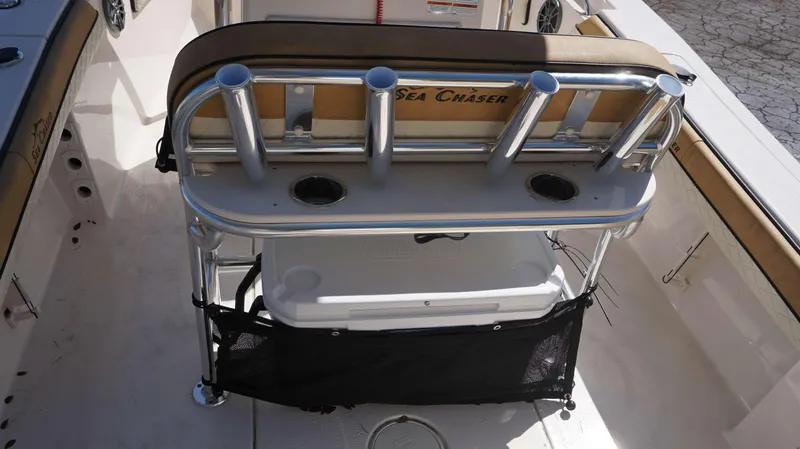 Slide: The Image of 2023 Sea Chaser 20 HFC boat interior with rod holders and Coleman cooler. - 10