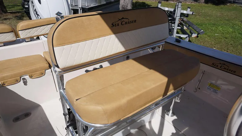 Slide: The Image of 2023 Sea Chaser 20 HFC boat with tan and white cushioned seating. - 14