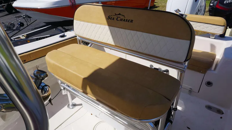 Slide: The Image of 2023 Sea Chaser 20 HFC boat seating with tan and white upholstery. - 15