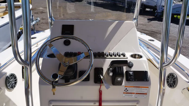 Slide: The Image of 2023 Sea Chaser 20 HFC boat console with steering wheel and control panel. - 3