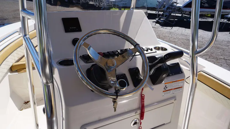 Slide: The Image of 2023 Sea Chaser 20 HFC boat console with steering wheel and controls. - 4