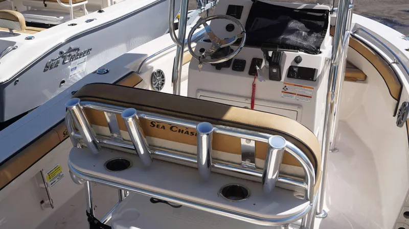 Slide: The Image of 2023 Sea Chaser 20 HFC boat interior with steering console and rod holders. - 6