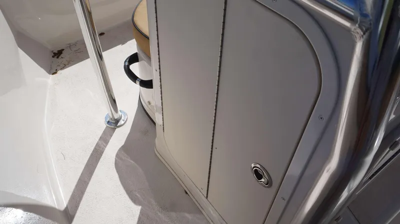 Slide: The Image of Interior view of 2023 Sea Chaser 20 HFC boat, featuring storage compartment and seating. - 8