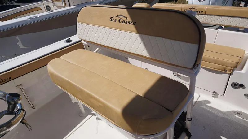 Slide: The Image of 2023 Sea Chaser 22 HFC boat seating with tan and white upholstery. - 10