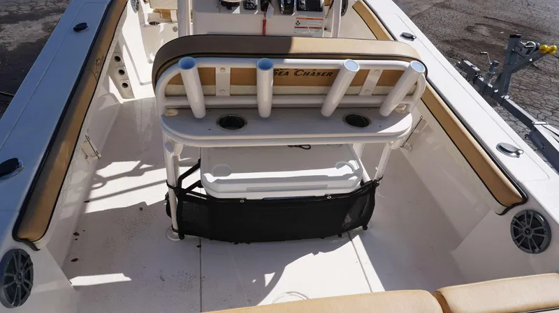 Slide: The Image of 2023 Sea Chaser 22 HFC boat interior with seating and rod holders. - 11