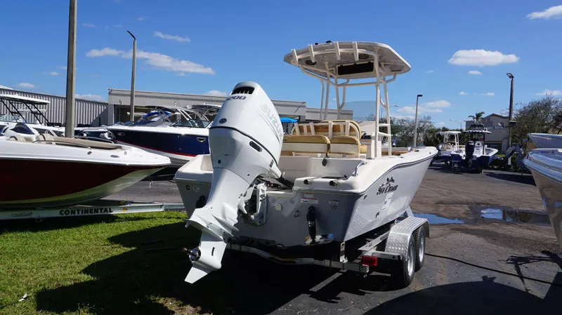 Slide: The Image of 2023 Sea Chaser 22 HFC boat with Suzuki outboard motor on trailer. - 3