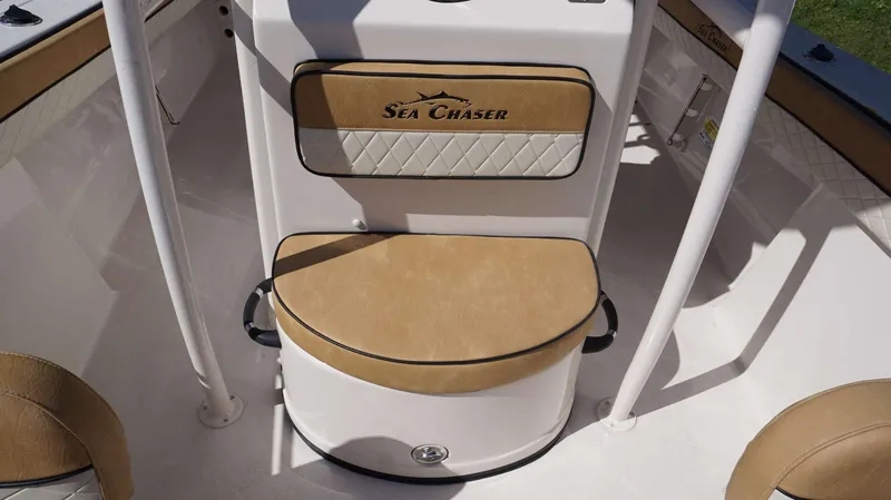 Slide: The Image of 2023 Sea Chaser 22 HFC boat interior with tan cushioned seating. - 9