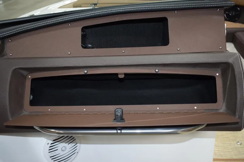 Slide: The Image of Interior of a 2019 Cobalt CS23 Surf boat with beige seating. - 10