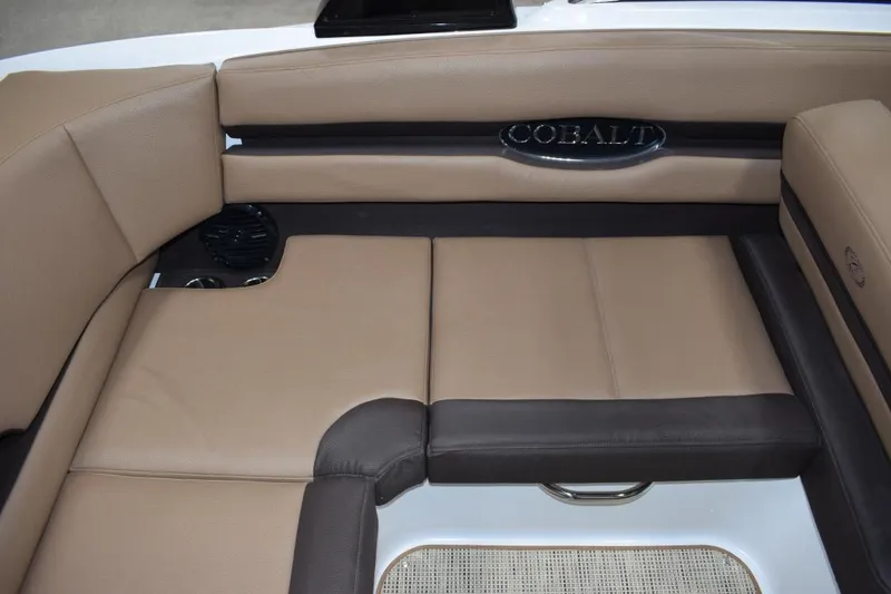 Slide: The Image of Interior of a 2019 Cobalt CS23 Surf boat, brown leather seats. - 11