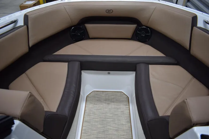 Slide: The Image of Interior of a 2019 Cobalt CS23 Surf boat with brown seating. - 12