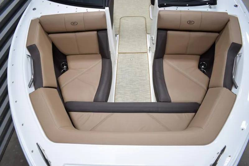 Slide: The Image of Interior of a 2019 Cobalt CS23 Surf boat with beige seating. - 13