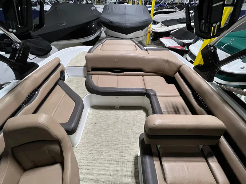 Slide: The Image of Interior of a 2019 Cobalt CS23 Surf boat with brown seating. - 14
